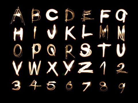 Light painting illustration of the alphabet and numbers 1 to 9