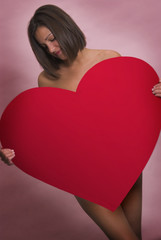 Woman holding large heart