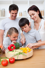 Happy parents and children cooking