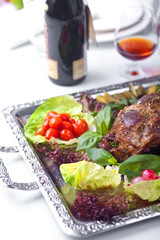 The baked mutton foot with vegetables and grasses