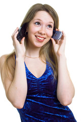 beautiful smiling girl with two cellular phones on a white