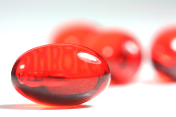 Red capsule pill