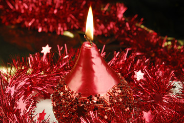 red candle and tinsel