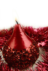 red candle and tinsel
