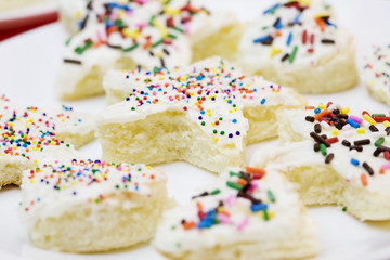 Frosted cake pieces with sprinkles