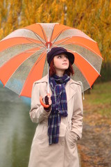 Beautiful young girl under umbrella