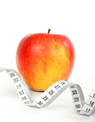 Apple and a measure tape, diet concept