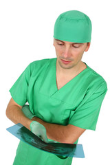 Doctor looking at x-ray (isolated on white)