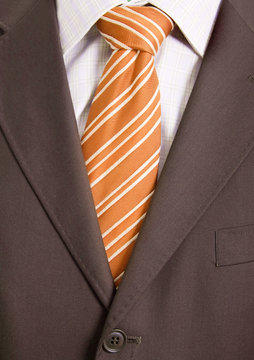 Detail of a Business man suit with orange tie