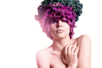 portrait of a woman with cauliflower in a had