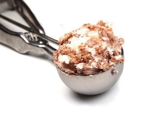 A iron handled ice cream scoop.