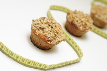 Crunchy carrot muffins with centimeter on white