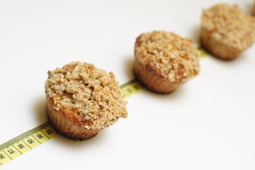 Crunchy carrot muffins on measuring tape
