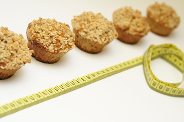 Crunchy carrot muffins with centimeter on white