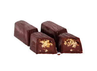 Chocolates with almonds on the white isolated background