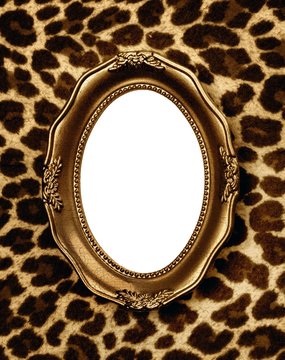 Golden frame on leopard skin background