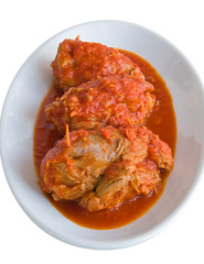 Meat roulade with tomato sauce on plate