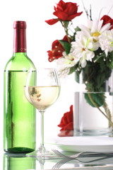 Bottle and glass of wine on the table