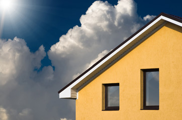 Abstract house facade under the blue sky
