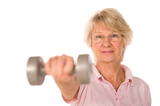 Older senior lady lifting weights