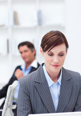 Portrait of a confident businesswoman sitting at office desk