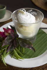 Coconut sundae with tropical decoration