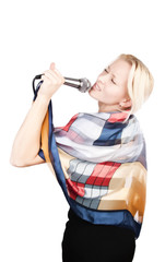 Attractive blonde singing with passion