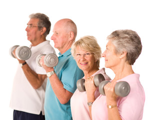 Mature older people lifting weights