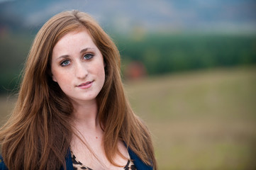 Fototapeta na wymiar Red-headed teen girl outdoors