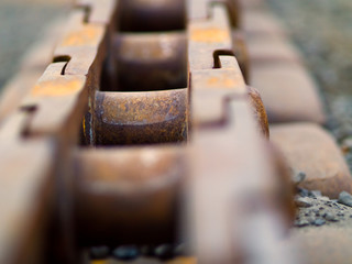 Old Rusty Continuous Tracks on Gravelly Ground