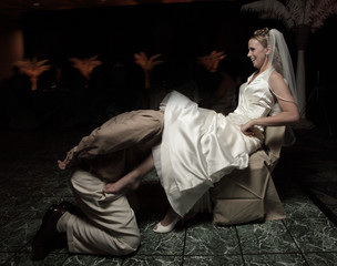 Groom removing the garter belt