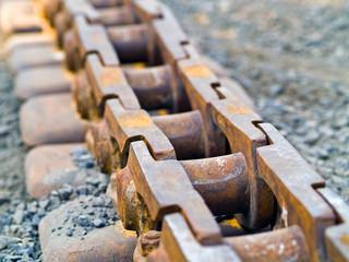 Old Rusty Continuous Tracks on Gravelly Ground