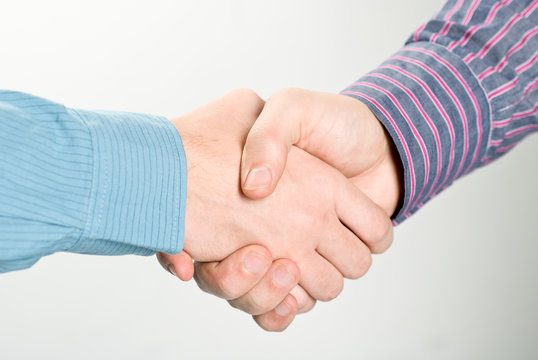 Shaking hands studio shot. Clipping path included.