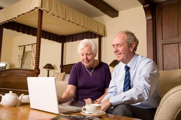 Senior couple with laptop