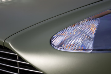 English sportscar front in green matt