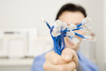 Young Businessman Holding Network Connection Cables