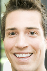 Young Man Smiling at Camera
