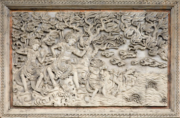 Traditional stone carving in a temple in Bali.