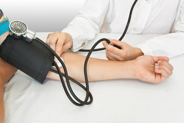 medicine concept. doctor measures pressure in the patient