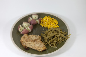 Plate with Chicken, corn, green beans and potatoes