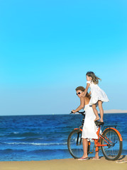 Fototapeta premium woman and girl on the beach