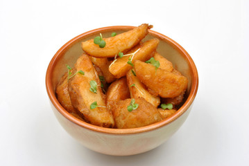 some fried potato wedges in a bowl