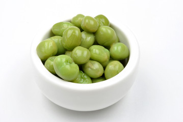 some organic and fresh pea in a white bowl