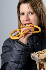 woman eating pretzel