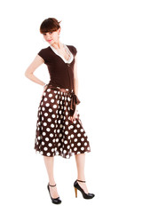 Beautiful alluring girl in spotted skirt