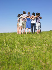 Group of People in Huddle in Field