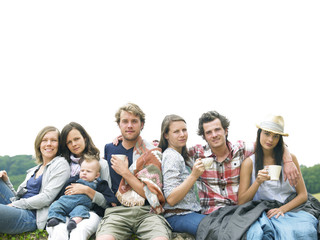 Fototapeta premium Group of People Relaxing Outdoors With Coffee