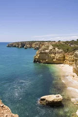 Fotobehang Marinha Beach, Algarve, Portugal Rotsachtig strand