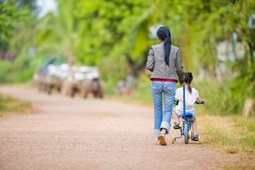 mother and daughter on the road