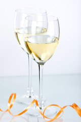 Two wine glasses with white wine